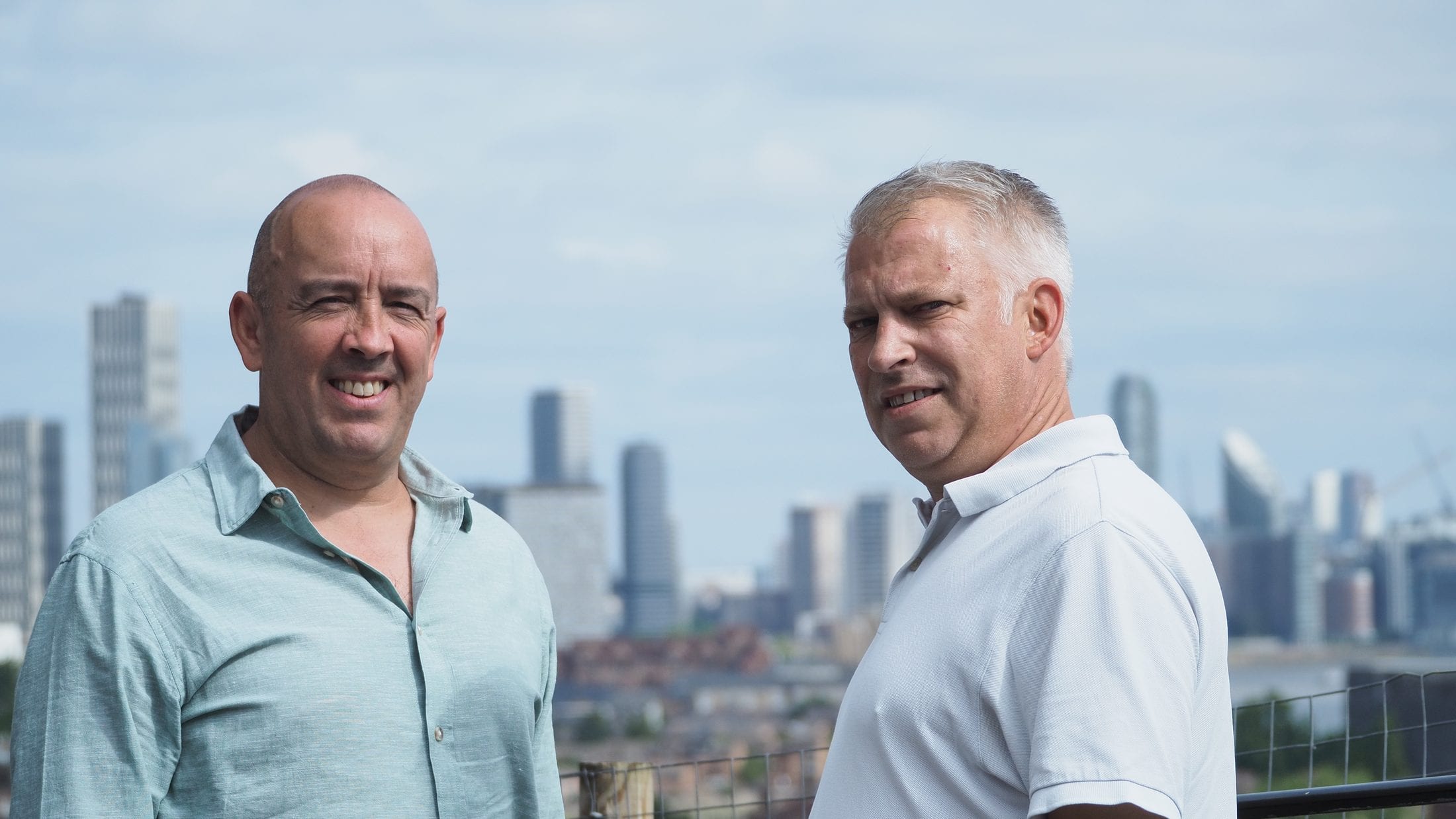Oliver Woodhead and Warren Day, founders of Momentum Inspire, above the London skyline